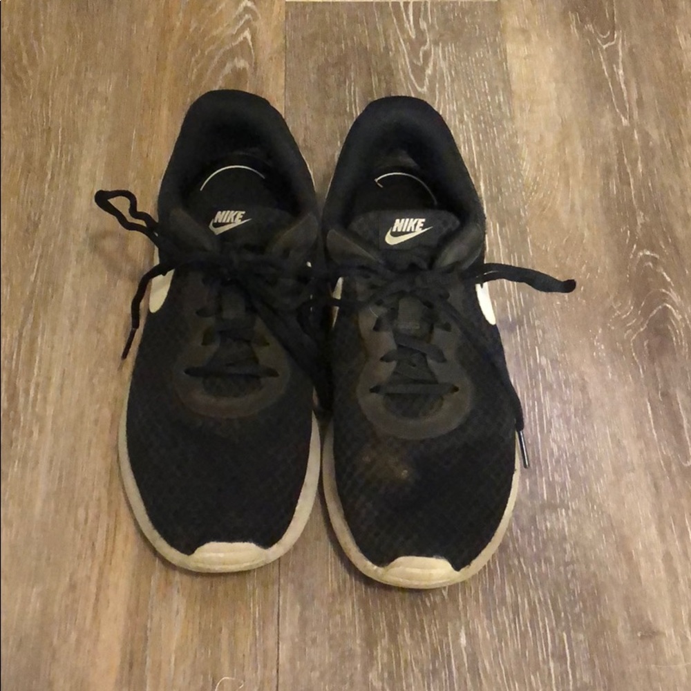 Very worn nike black running shoes